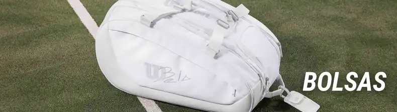 Bolsas de pádel funcionales para equipación completa Bolsa de pádel blanca Wilson sobre césped artificial